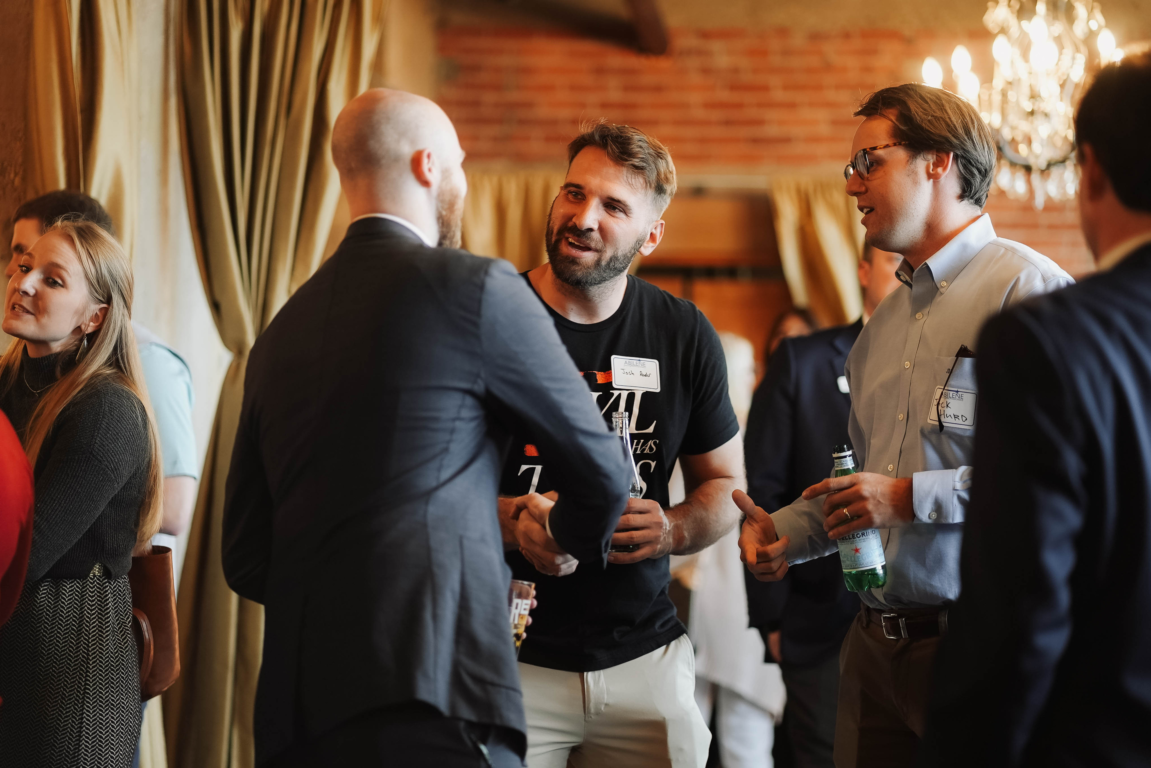 men shaking hands at networking event